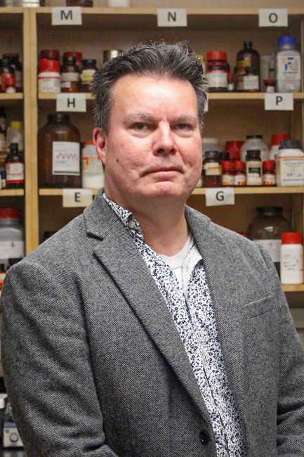 USask researcher and chemistry professor Dr. Lee Wilson (PhD'98), left, and PhD candidate Bernd Steiger hold bioplastic pellets designed to absorb contaminants in water. Photo by Kristen McEwen